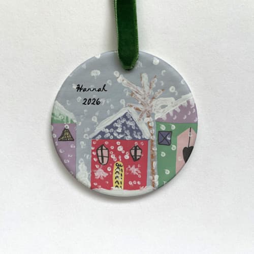 This is a white holiday decorations by Holly Whitcomb called custom ceramic photo ornament: your child's artwork in standard