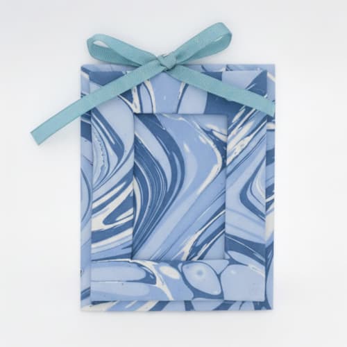This is a blue holiday decorations by Inner Child called mini hand-marbled picture frame ornament | ocean wave in standard