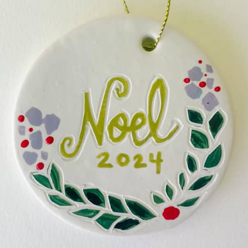 This is a multicolor holiday decorations by Sarah Fitzgerald called winter floral with name or initials. in standard