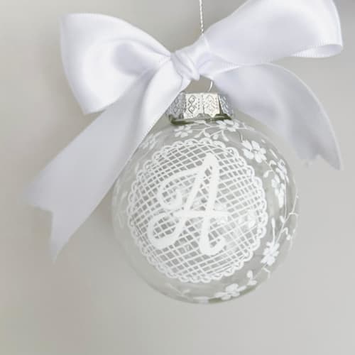 This is a white holiday decorations by Arohika Verma called personalized lace ornament in standard
