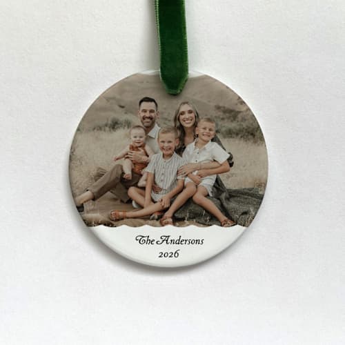 This is a white holiday decorations by Holly Whitcomb called personalized family photo ornament in standard