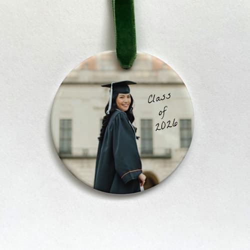 This is a white holiday decorations by Holly Whitcomb called custom ceramic photo ornament: grad script in standard