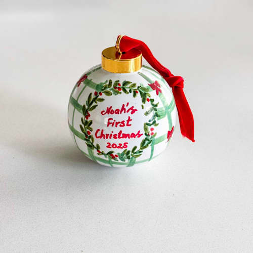 This is a green holiday decorations by Arohika Verma called personalized hand-painted “baby’s first christmas” ornament – red and green holiday design in standard