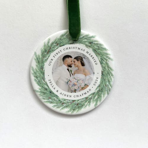 This is a multicolorassorted-colors holiday decorations by Holly Whitcomb called personalized newlywed photo ornament - juniper wreath in standard
