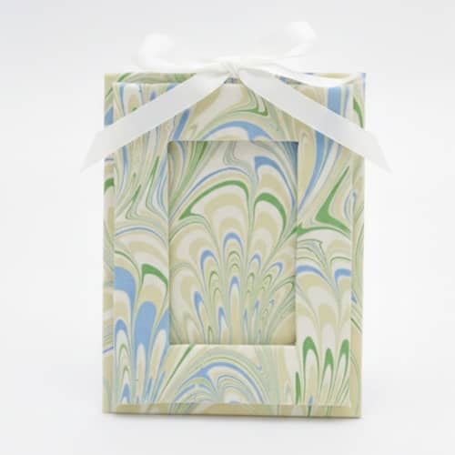 This is a green holiday decorations by Inner Child called mini hand-marbled picture frame ornament | seaglass peacock in standard