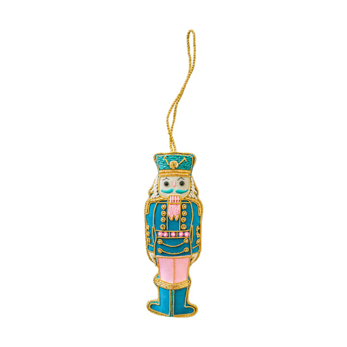 This is a multicolor holiday decorations by Jollity and Co called blue & pink embroidered nutcracker christmas ornament in standard