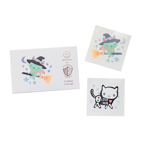 This is a white party favors by Jollity and Co called meowloween temporary tattoos in standard