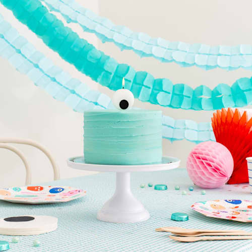 This is a multicolor party decorations by Jollity and Co called little monsters large candle in standard