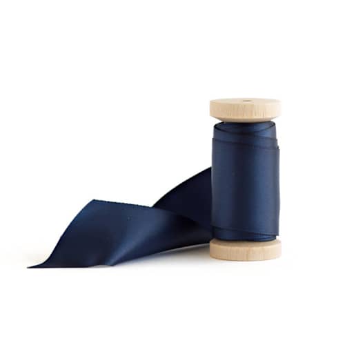 This is a navy wedding ribbon by Minted called navy satin in standard