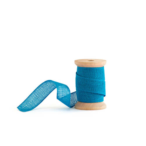 This is a baby blue wedding ribbon by Minted called baby blue loose weave cotton in standard