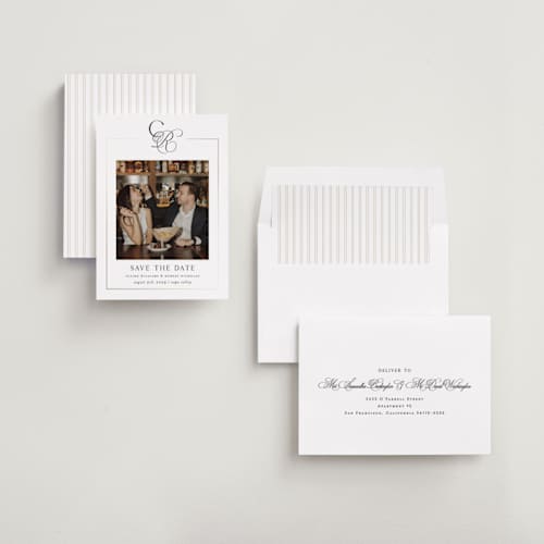 This is a silk foil stamped save the date cards with foil pressed by Kelly Schmidt called monogram script printing on recycled smooth signature in standard