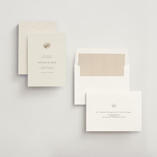 This is a sand foil stamped save the date cards with foil pressed by Hannah Bowman called simple seashell printing on signature in 5x7