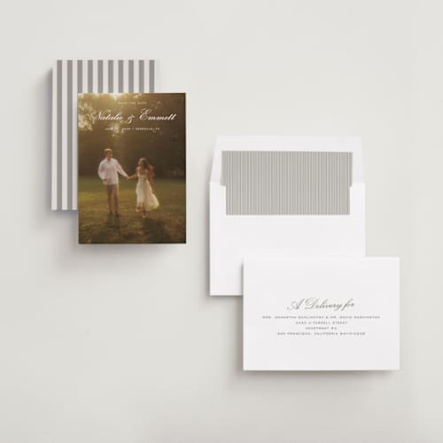 This is a ivory foil stamped save the date cards with foil pressed by Emily Betts called story printing on recycled smooth signature in standard