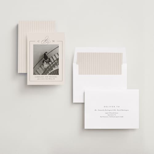 This is a linen foil stamped save the date cards with foil pressed by Kelly Schmidt called framed monogram printing on recycled smooth signature in standard