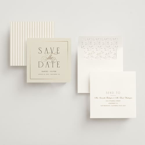 This is a ivory foil stamped save the date cards with foil pressed by Ana Sharpe called heirloom union printing on signature in standard