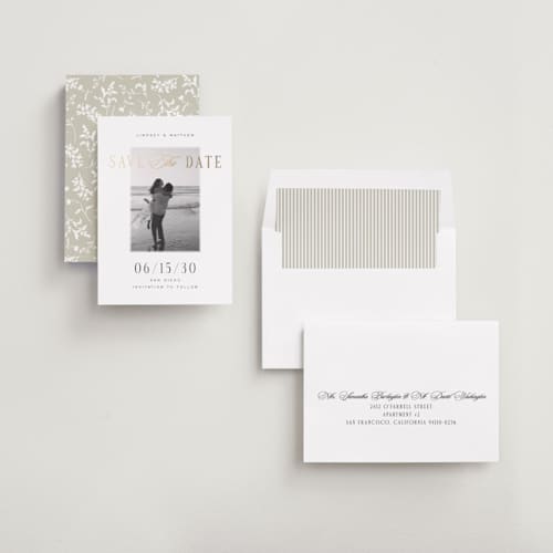 This is a noir foil stamped save the date cards with foil pressed by Jennifer Postorino called layered printing on recycled smooth signature in standard