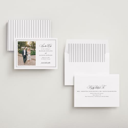 This is a snow foil stamped save the date cards with foil pressed by Sarah Brown called traditionally printing on recycled smooth signature in standard