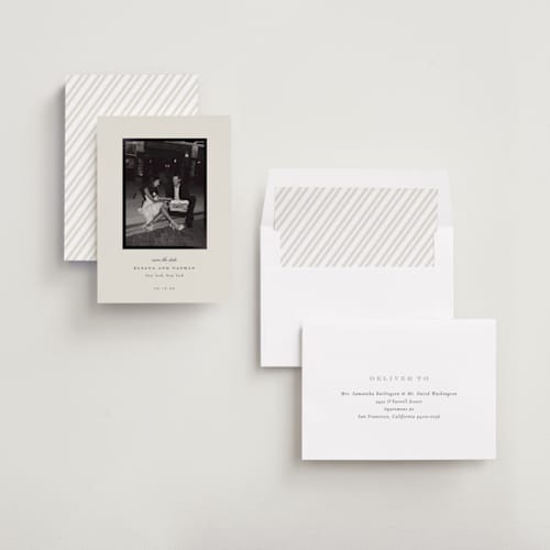 This is a cream foil stamped save the date cards with foil pressed by Sara Hicks Malone called classically yours printing on recycled smooth signature in standard