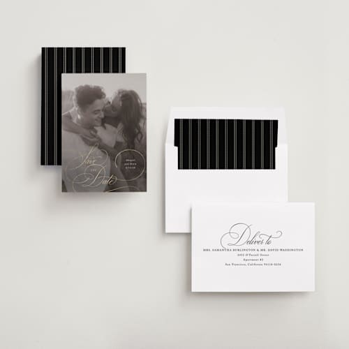 This is a cream foil stamped save the date cards with foil pressed by Hooray Creative called elegantly scripted printing on recycled smooth signature in standard
