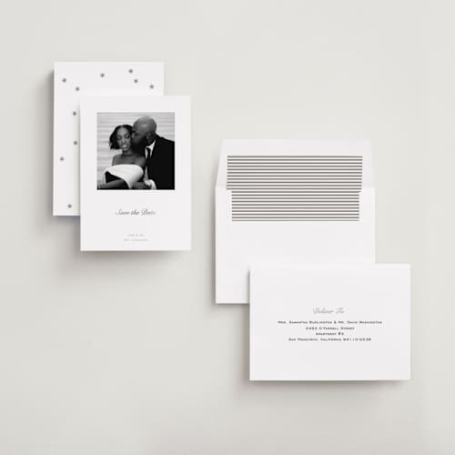 This is a snow foil stamped save the date cards with foil pressed by Megan Davis called curate printing on recycled smooth signature in standard