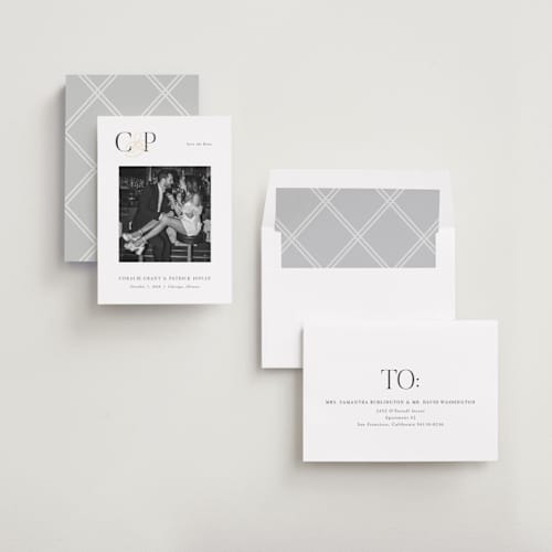 This is a pearl foil stamped save the date cards with foil pressed by Melanie Kosuge called bold monogram printing on recycled smooth signature in standard