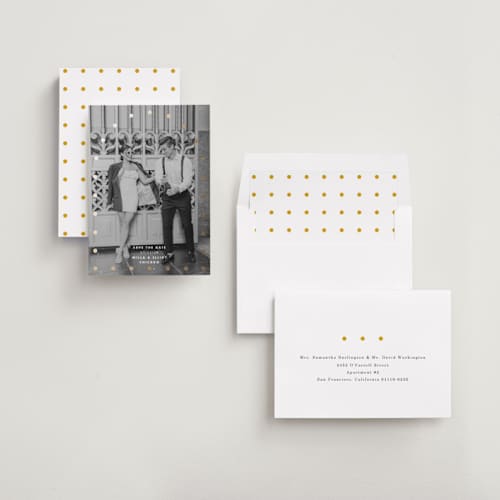 This is a quartz foil stamped save the date cards with foil pressed by Baumbirdy called spotlight printing on recycled smooth signature in standard