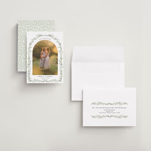 This is a mojito petite save the dates with standard by Susan Moyal called monogramed arch printing on recycled smooth signature in petite