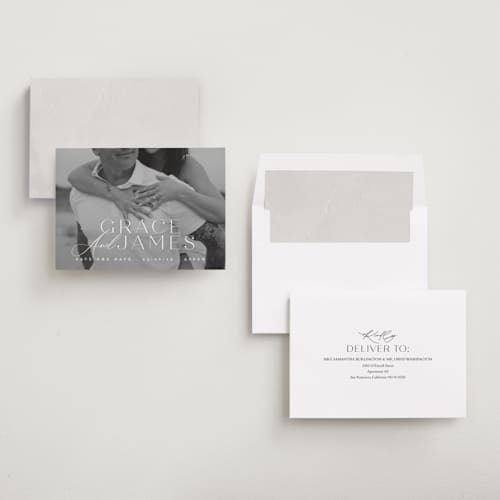 This is a snow save the date with standard by Angela Thompson called namesake printing on recycled smooth signature in standard