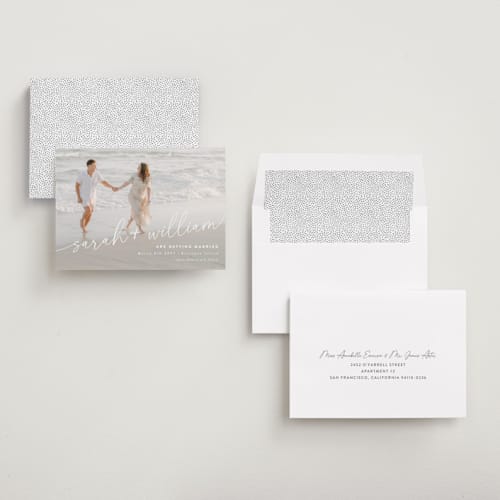This is a ivory save the date with standard by Jessie Steury called sweet script printing on recycled smooth signature in standard