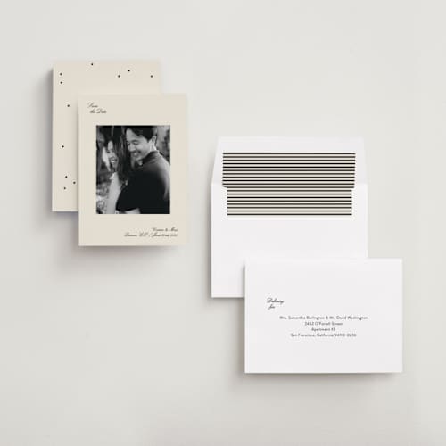 This is a graphite save the date with standard by Megan Davis called gimlet printing on recycled smooth signature in standard