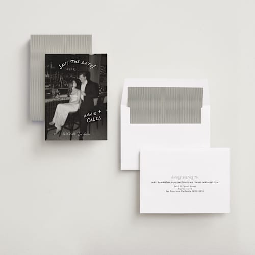 This is a ivory save the date with standard by Stephanie Heinrich Godbout called lovers printing on recycled smooth signature in standard