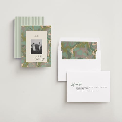 This is a sage save the date with standard by Leia Matt called marbled editorial printing on recycled smooth signature in standard