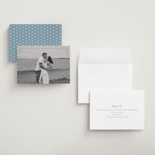 This is a french blue save the date with standard by Carolyn MacLaren called fleur corner printing on recycled smooth signature in grand