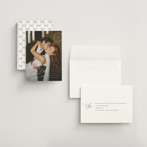 This is a pearl save the date with standard by Leah Bisch called scripted date printing on recycled smooth signature in grand