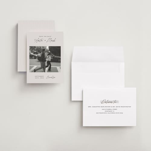 This is a eggshell save the date with standard by Paper Raven Co. called moment in time printing on recycled smooth signature in grand