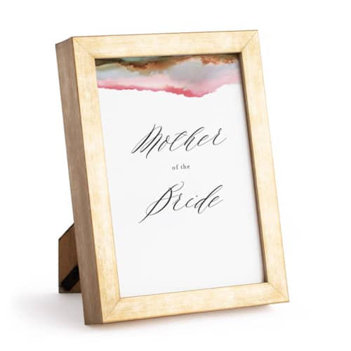 This is a brass gold place card holders by Minted called gold 5x7 in standard