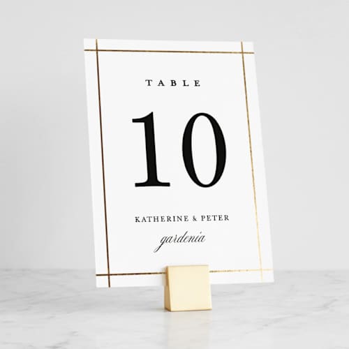 This is a gold place card holders by Minted called brushed gold cube in standard