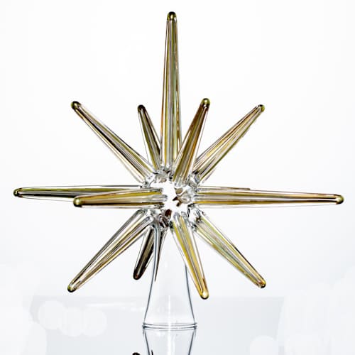 This is a gold holiday decorations by Albrecht Art Glass called gold glass moravian christmas tree star in standard