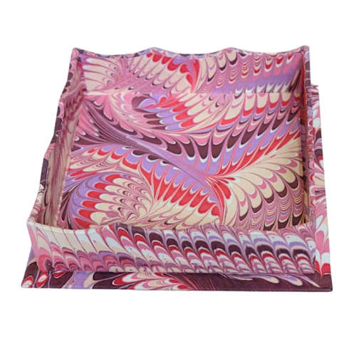 This is a pink decorative objects by Inner Child called nesting scalloped hand-marbled trays in florentine pink - small in standard