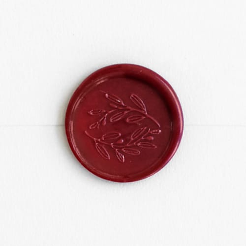 This is a traditional red wax seals by Minted called olive wreath in sangria | maurelle calligraphy x artisaire (pack of 25) in standard