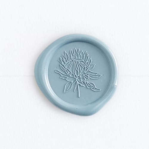 This is a dusty blue wax seals by Minted called protea in blue | papel and co. x artisaire (pack of 25) in standard