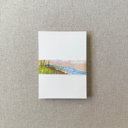 This is a multicolor belly bands by Cotton and Bow called beach watercolor vellum belly band | for petite 4.25x6" invitations | set of 10 in standard
