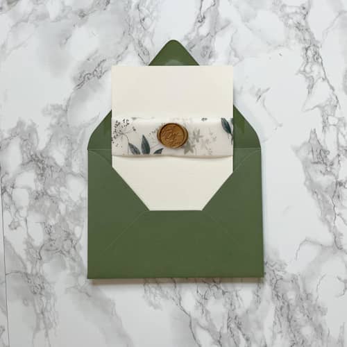 This is a clear belly bands by Carley Zuercher called green wildflower vellum belly band for wedding invitations 1.5" (25 pack) in standard