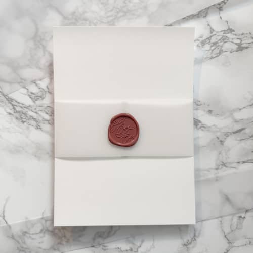 This is a clear belly bands by Carley Zuercher called 2" vellum belly band wrap for wedding invitations (25 pack) in standard