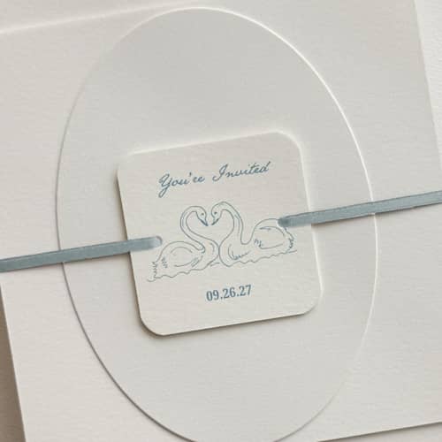 This is a multicolorassorted-colors belly bands by Paper Haven called customizable swan bellyband tags with ribbon for 5 x 7 invitation | pack of 25 in standard