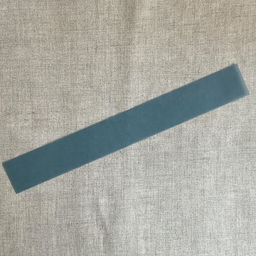 This is a blue belly bands by Ivory Invitations called steel blue colored translucent vellum belly band for 5x7 inch invitation | pack of 10 in standard