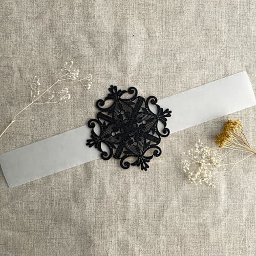 This is a black belly bands by Ivory Invitations called black glitter laser cut lace vellum belly band for 5x7 card | pack of 10 in standard