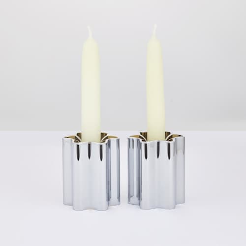 This is a silver wedding decor by Leadoff Studio called candle holders - chrome in standard