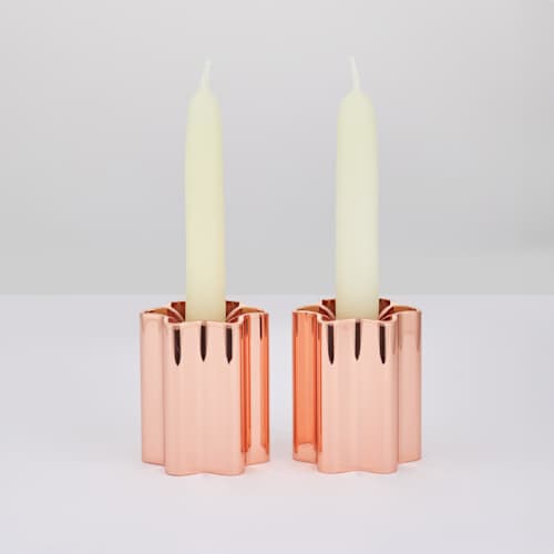 This is a copper wedding decor by Leadoff Studio called candle holders - rose gold in standard