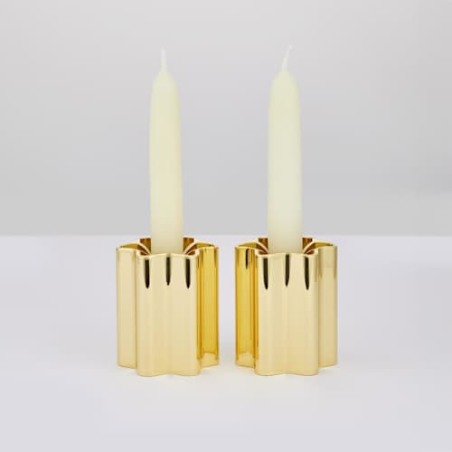 This is a brass wedding decor by Leadoff Studio called candle holders - brass in standard